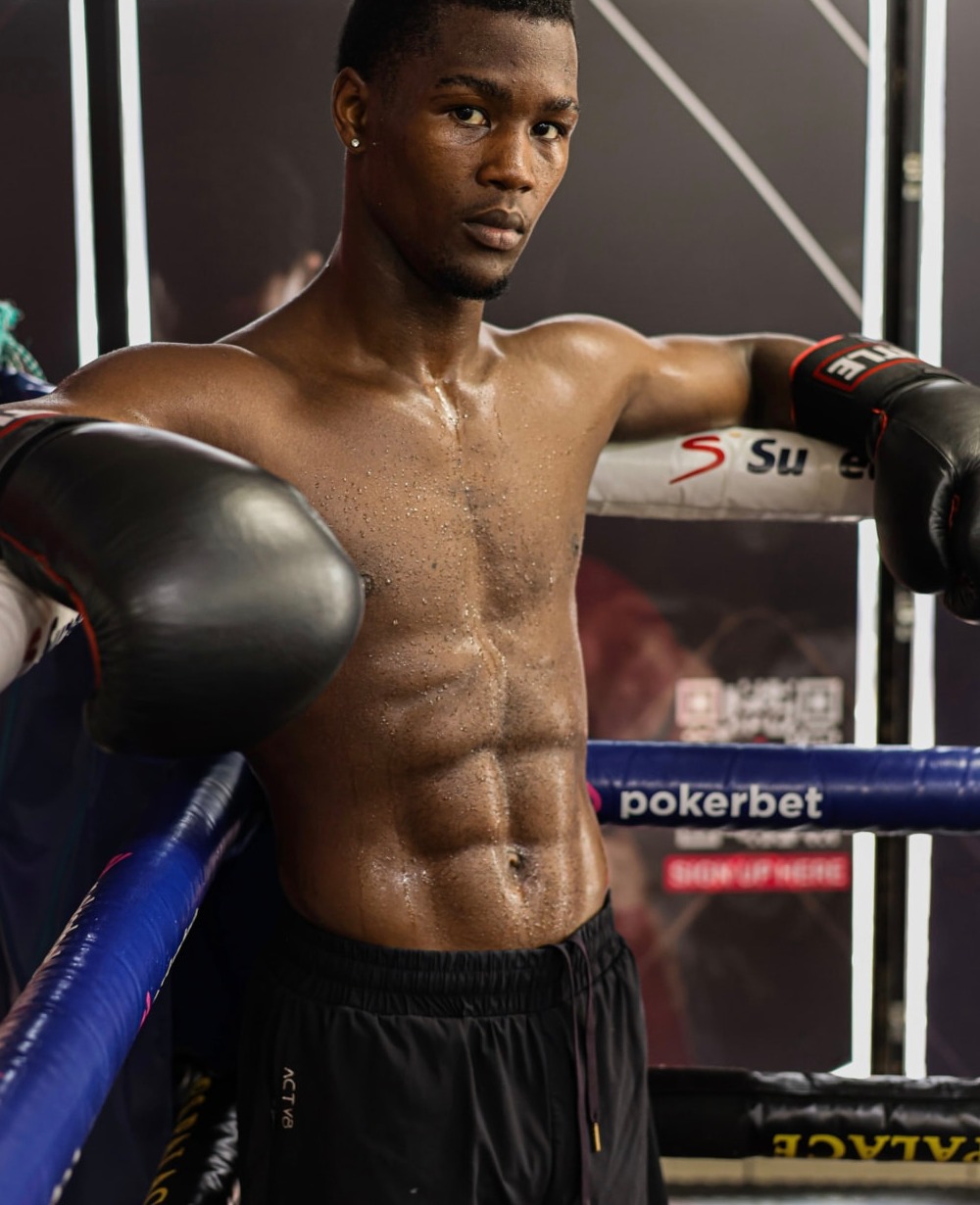 Sanele Sogcwayi resting on the ring ropes between rounds